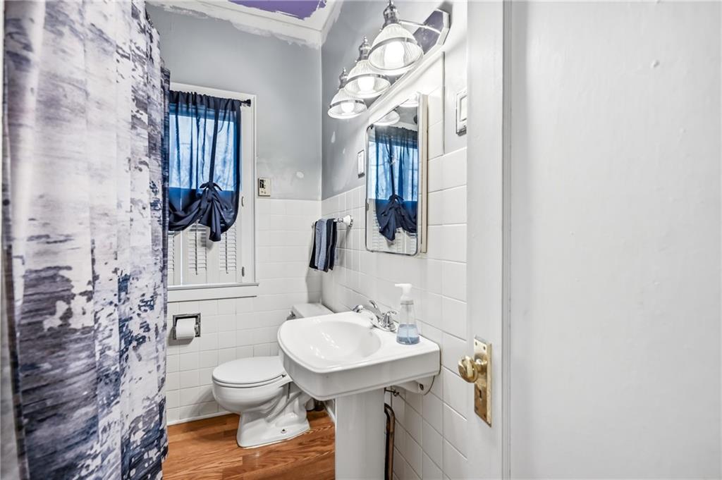 2411 Graceland Road New Castle, PA 16105 - Photo 22 of 50 a bathroom with a sink a toilet and shower
