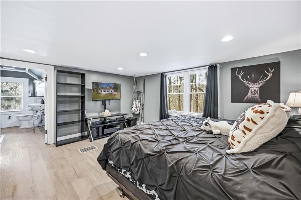 2411 Graceland Road New Castle, PA 16105 - Photo 25 of 50 a bedroom with a bed and a large window