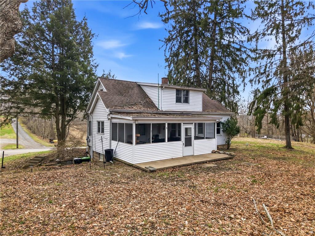 2411 Graceland Road New Castle, PA 16105 - Photo 37 of 50 a house with trees in the background