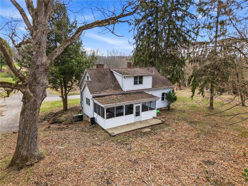 2411 Graceland Road New Castle, PA 16105 - Photo 40 of 50 a white house that has a tree in front of it