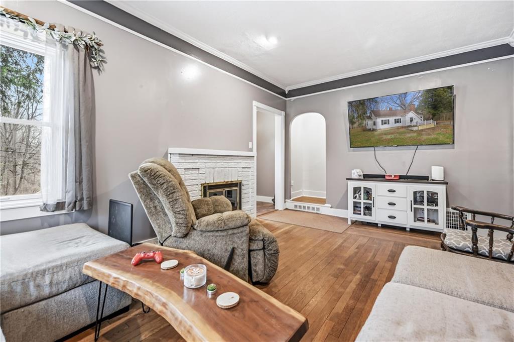 2411 Graceland Road New Castle, PA 16105 - Photo 5 of 50 a living room with furniture and a flat screen tv