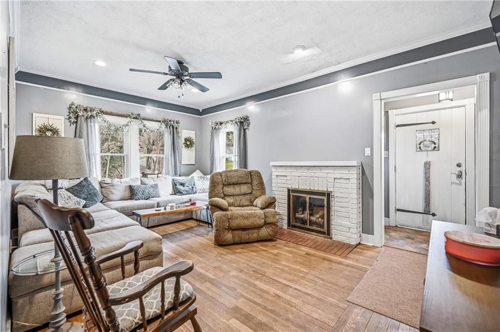 2411 Graceland Road New Castle, PA 16105 - Photo 7 of 50 a living room with furniture a fireplace and a flat screen tv