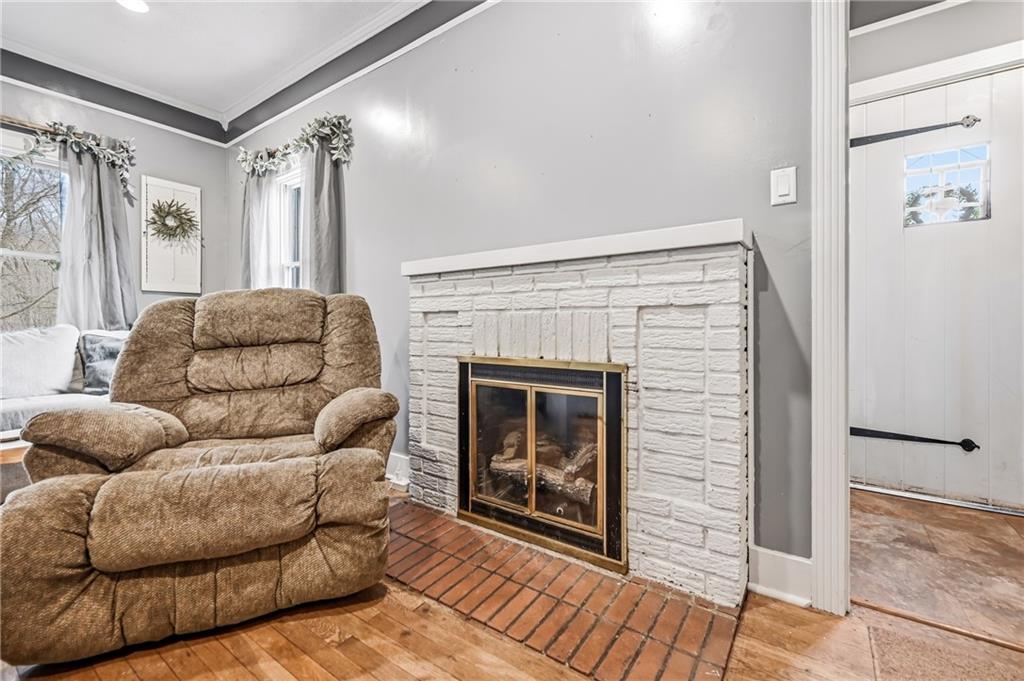 2411 Graceland Road New Castle, PA 16105 - Photo 8 of 50 a living room with furniture and a fireplace