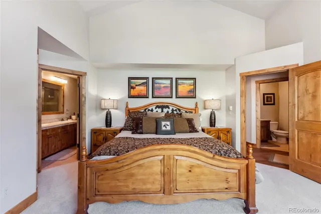 a bedroom with a bed and a view of bathroom