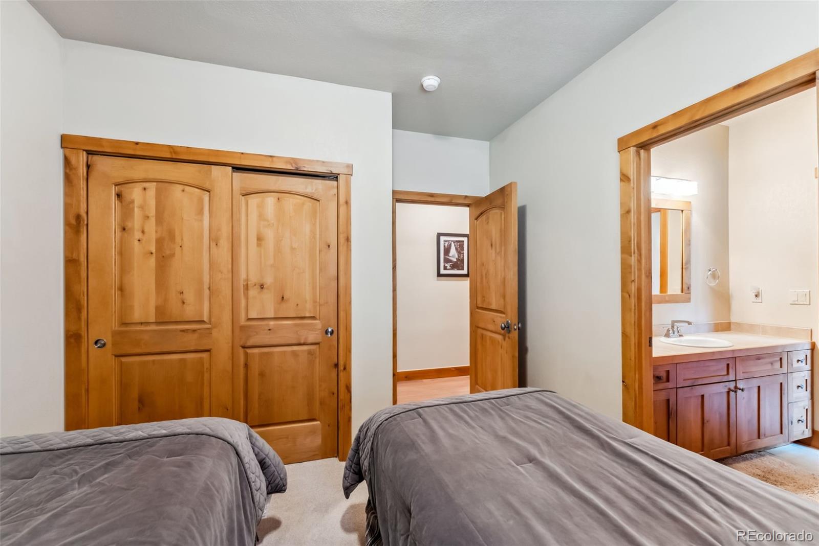 0024 Rasor Drive Dillon, CO 80435 - Photo 36 of 37 a bedroom with a bed and a dresser