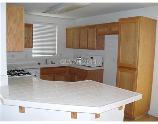 7191 Dicentra Road Las Vegas, NV 89113 - Photo 4 of 14 Kitchen. Abundant cabinetry and ample counterspace