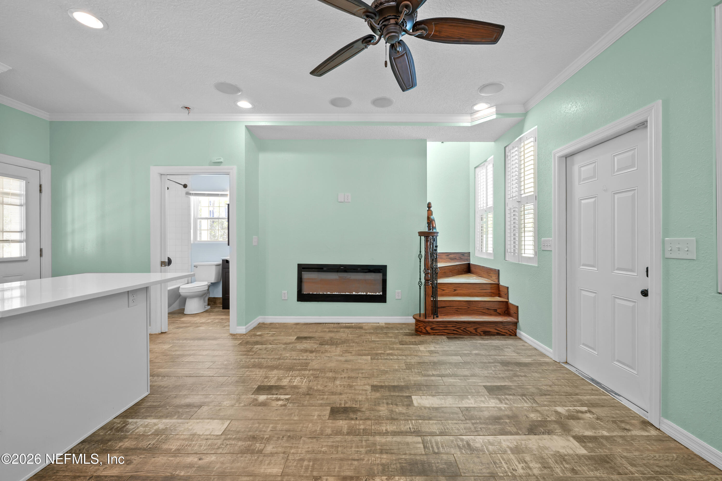 179 Georgetown Denver Road Georgetown, FL 32139 - Photo 12 of 24 a view of a hallway with stairs and a wooden floor