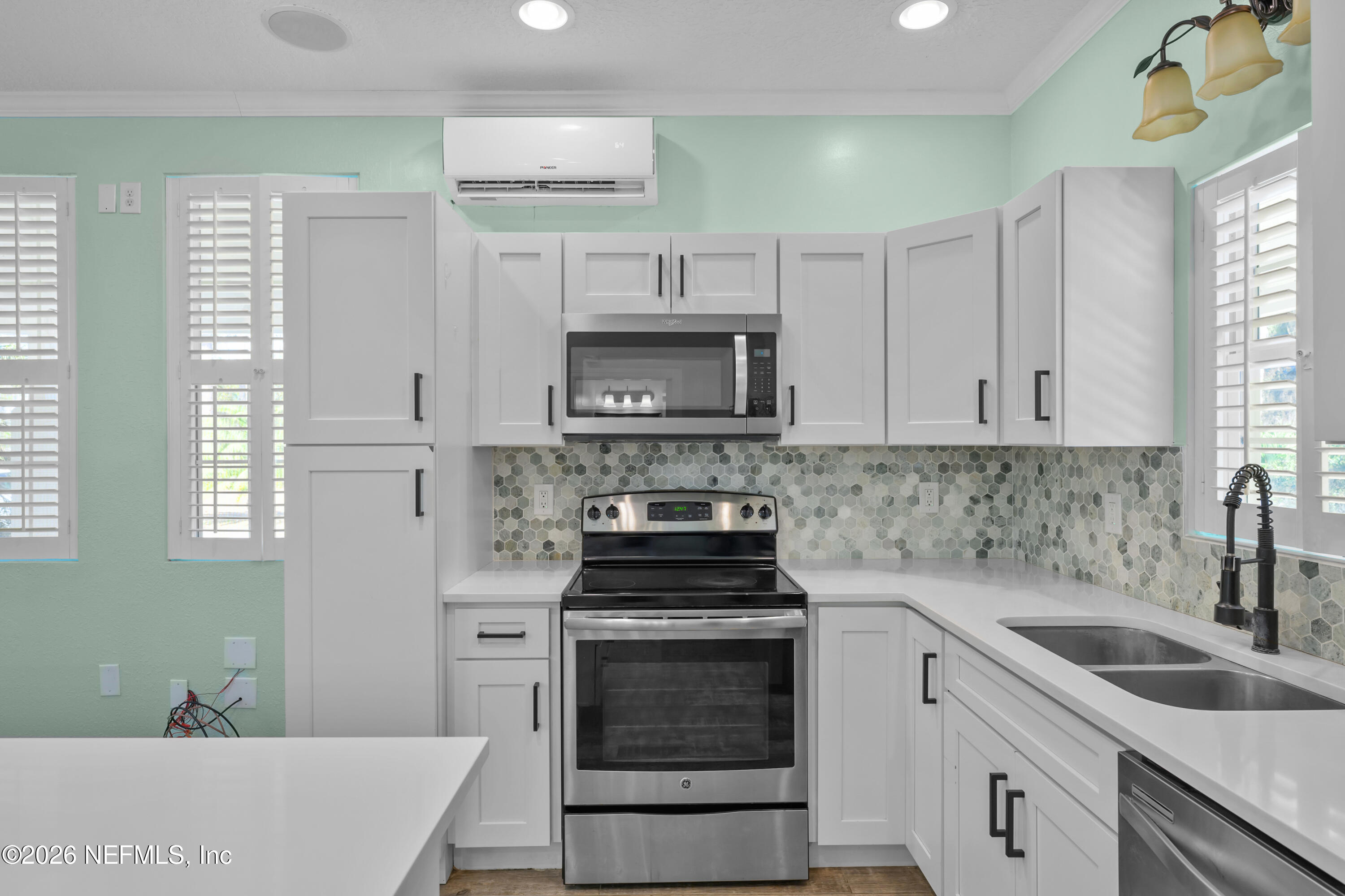 179 Georgetown Denver Road Georgetown, FL 32139 - Photo 15 of 24 a kitchen with granite countertop a stove sink and cabinets