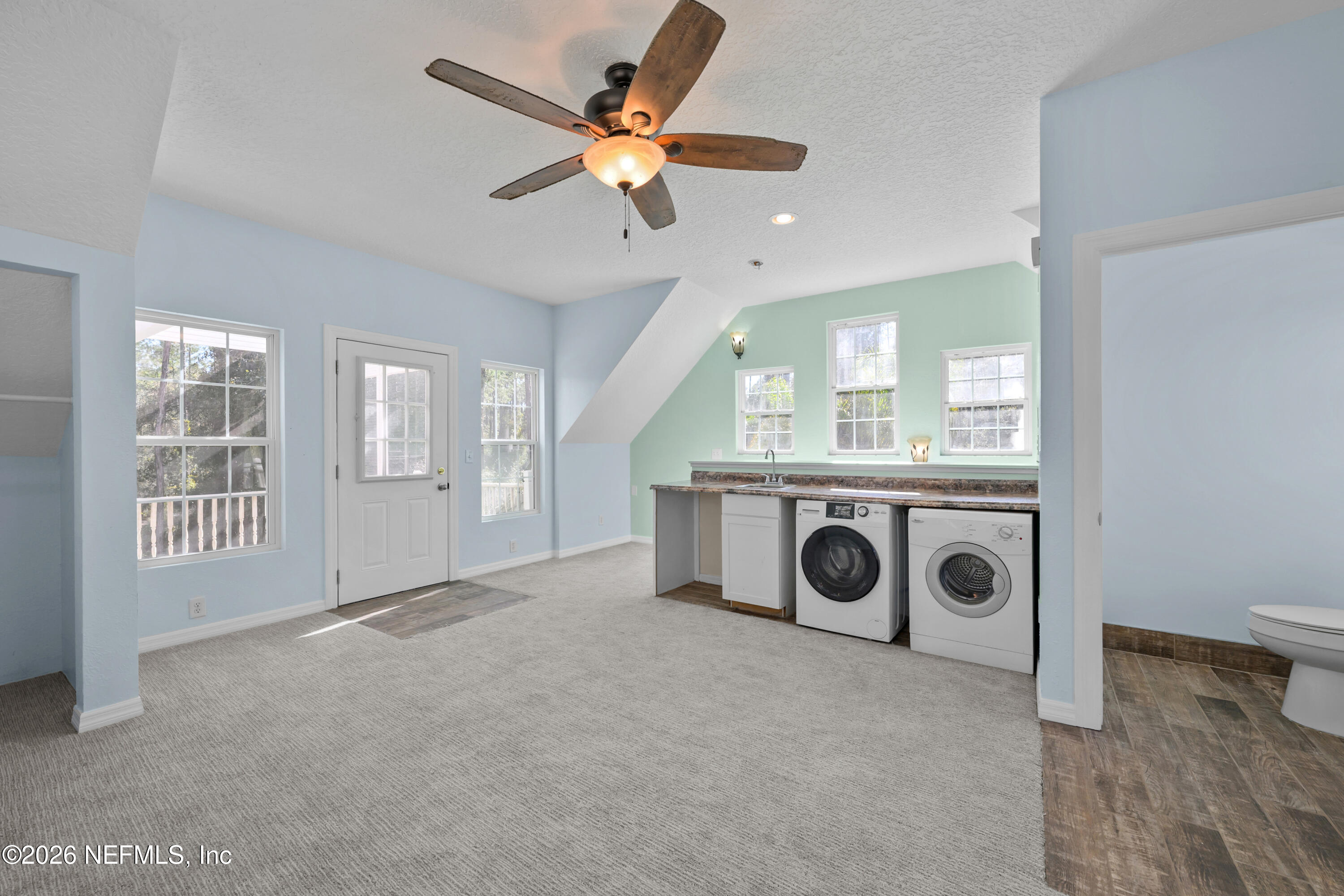 179 Georgetown Denver Road Georgetown, FL 32139 - Photo 19 of 24 a view of a livingroom with a ceiling fan and window