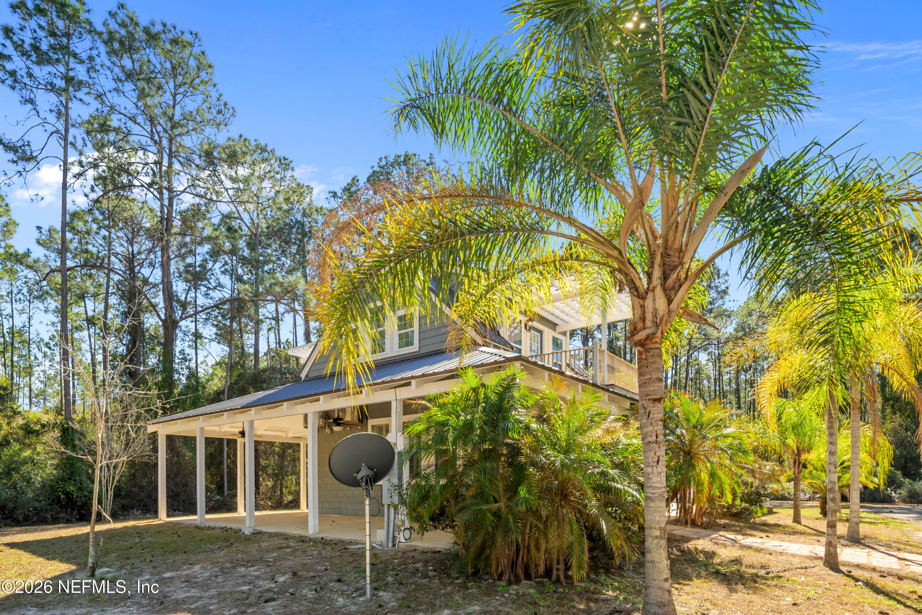 179 Georgetown Denver Road Georgetown, FL 32139 - Photo 2 of 24 a house with a tree in front of it