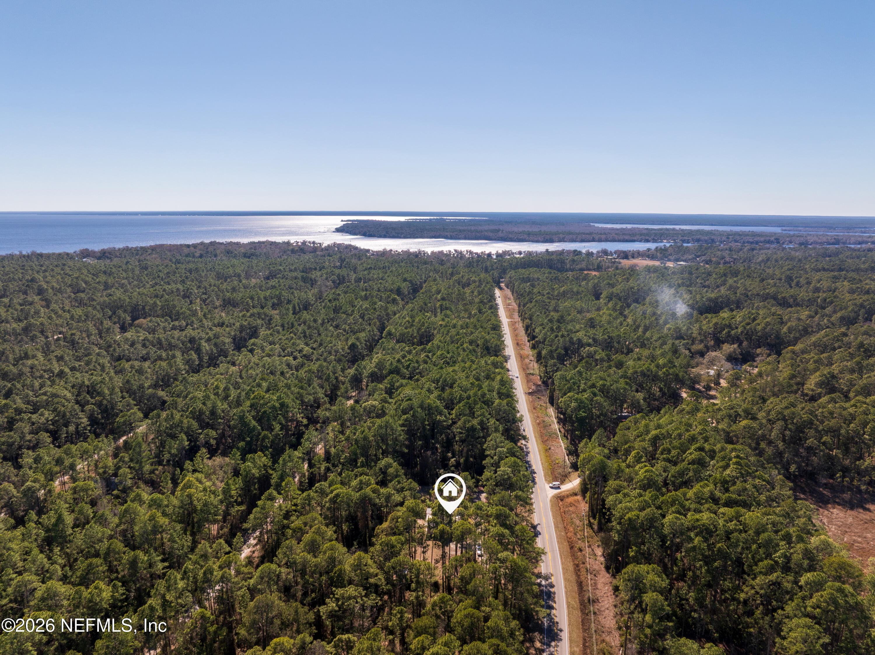 179 Georgetown Denver Road Georgetown, FL 32139 - Photo 22 of 24 a view of a city with lush green forest