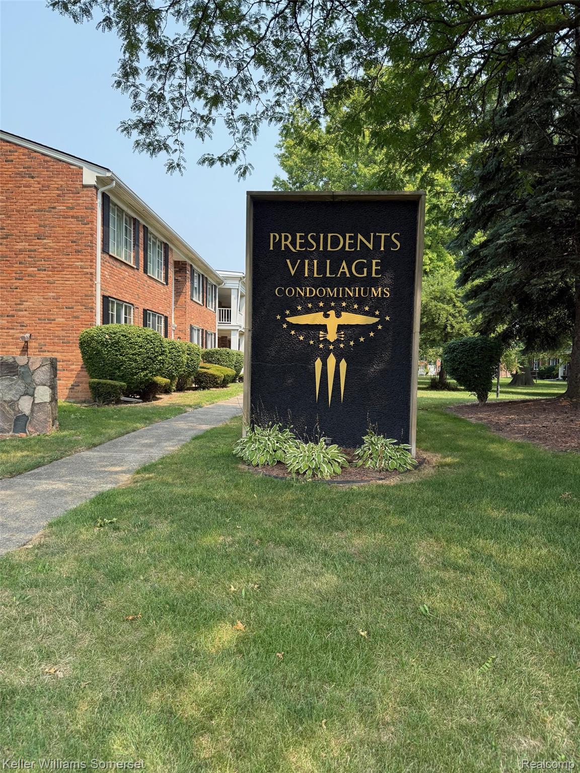 29626 Hoover Road, Unit 626 Warren, MI 48093 - Photo 35 of 35 Community / neighborhood sign featuring a lawn