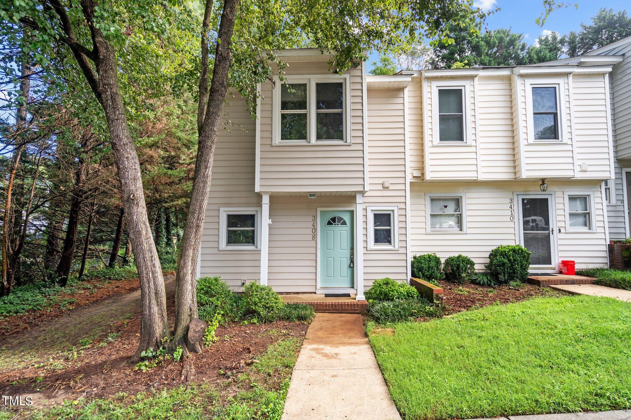 3408 Comstock Road Raleigh, NC 27604 - Photo 1 of 33 a front view of a house with garden