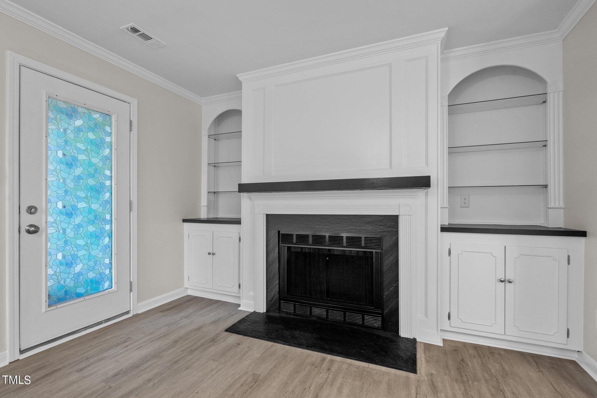 3408 Comstock Road Raleigh, NC 27604 - Photo 13 of 33 a living room with a fireplace