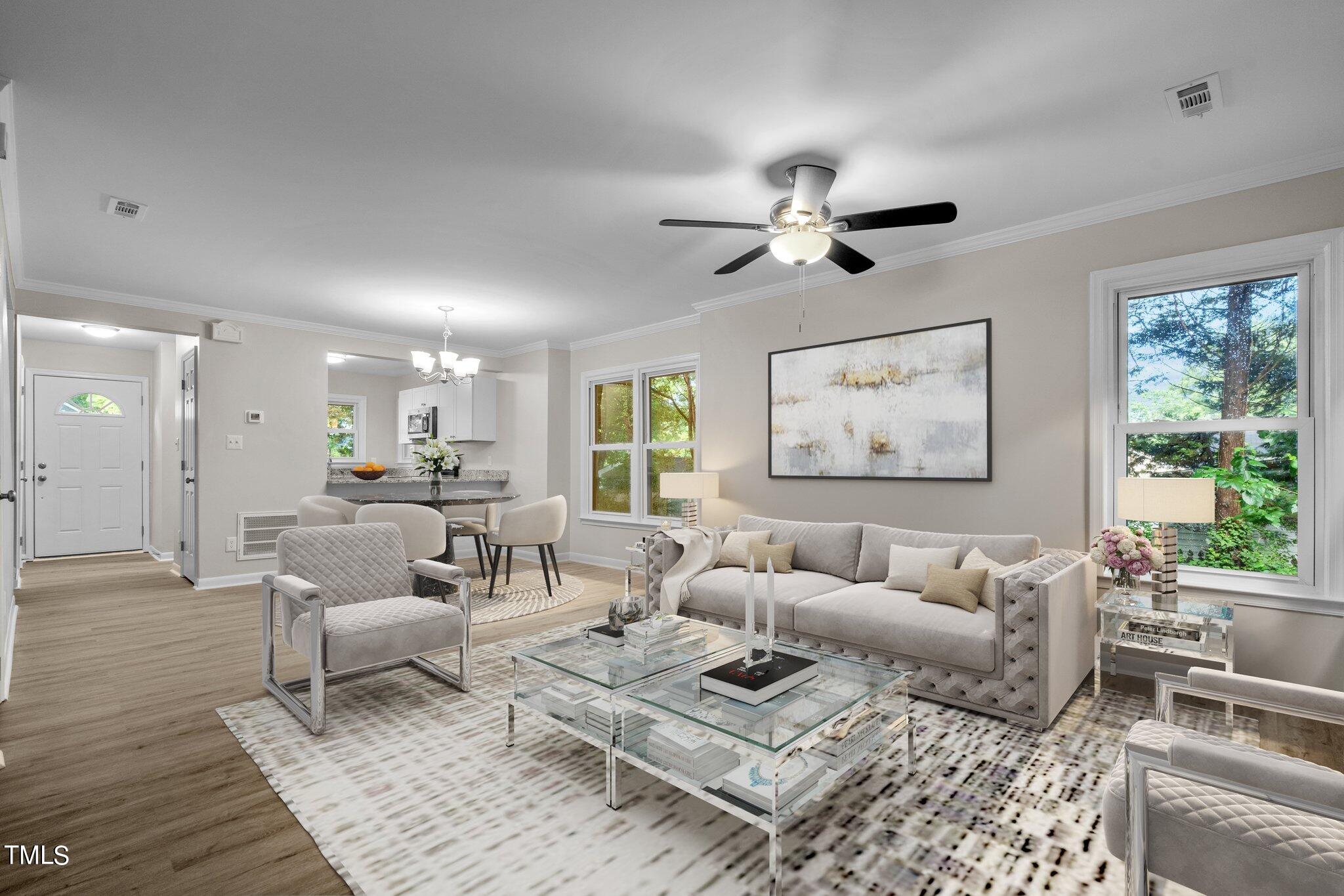 3408 Comstock Road Raleigh, NC 27604 - Photo 14 of 33 a living room with furniture ceiling fan and a rug