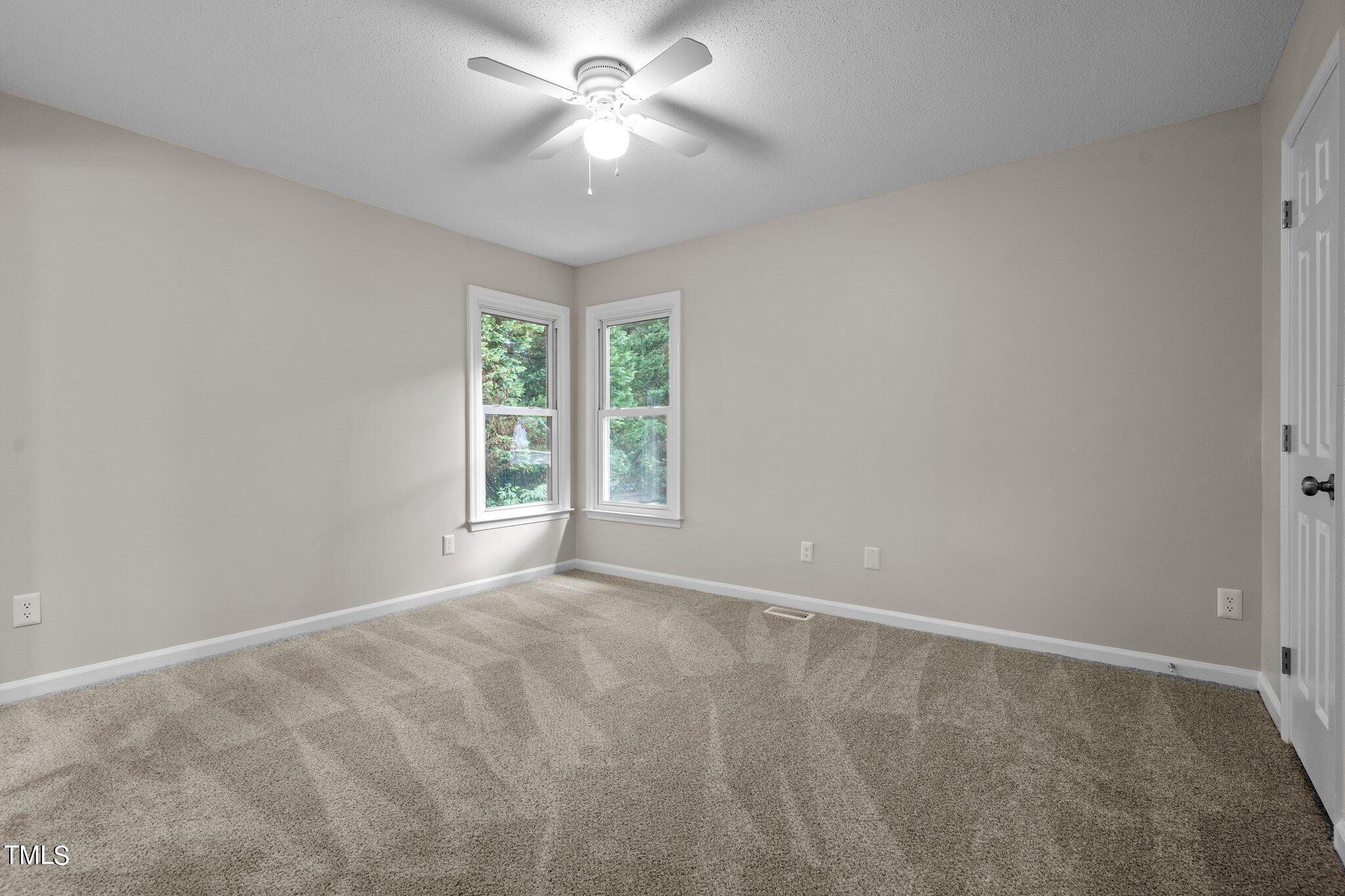 3408 Comstock Road Raleigh, NC 27604 - Photo 15 of 33 a view of an empty room with a window