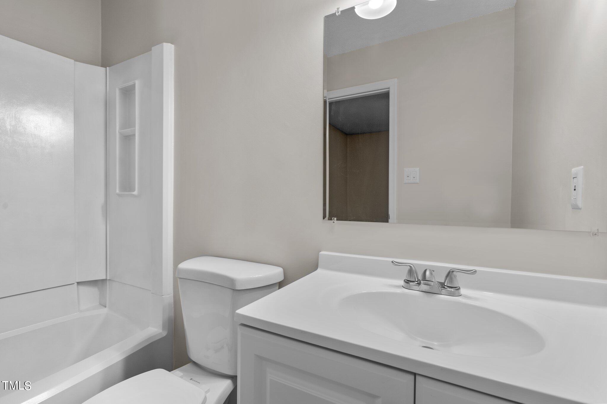 3408 Comstock Road Raleigh, NC 27604 - Photo 22 of 33 a bathroom with a sink toilet and shower