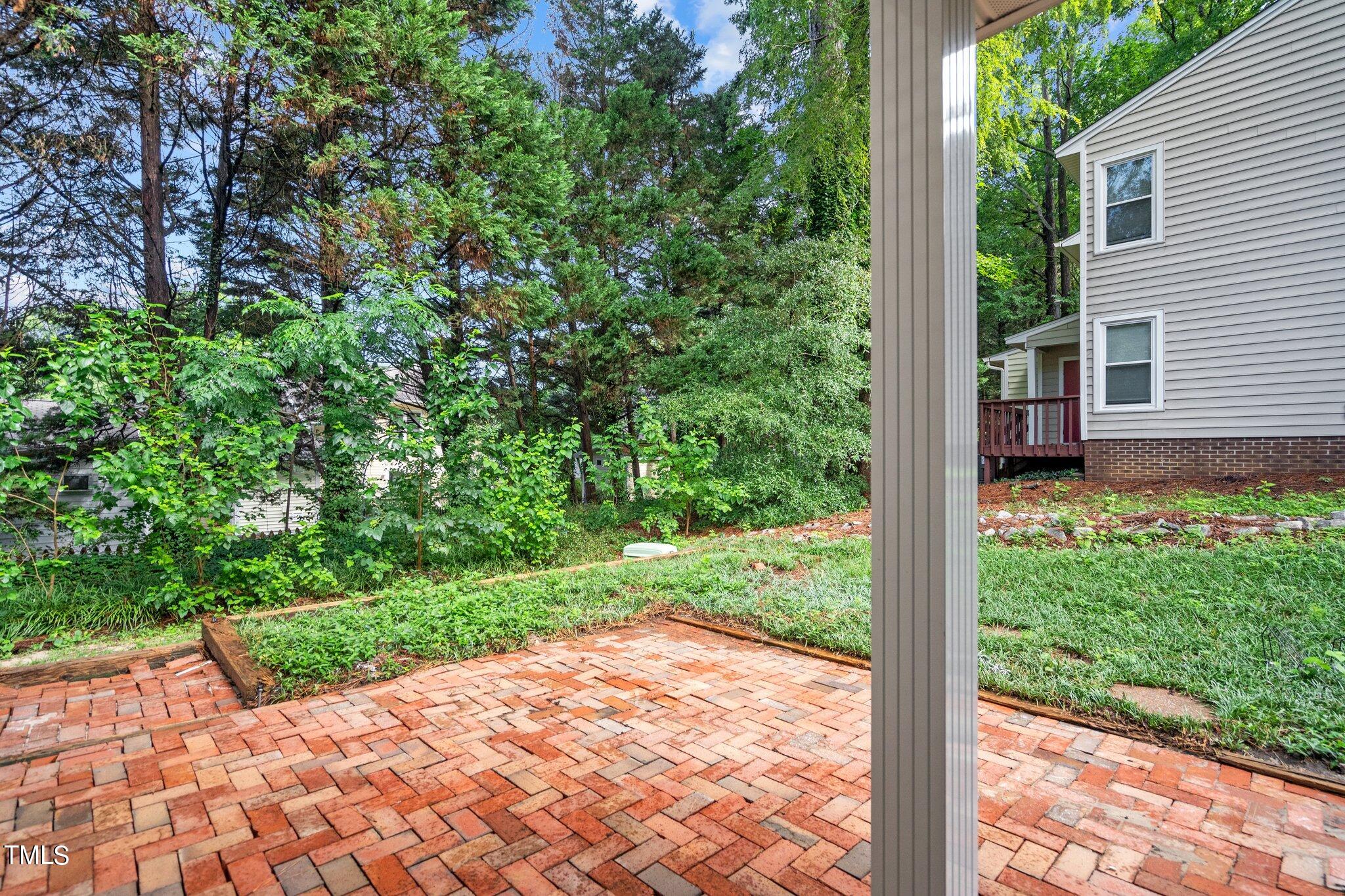 3408 Comstock Road Raleigh, NC 27604 - Photo 26 of 33 a view of a backyard with potted plants