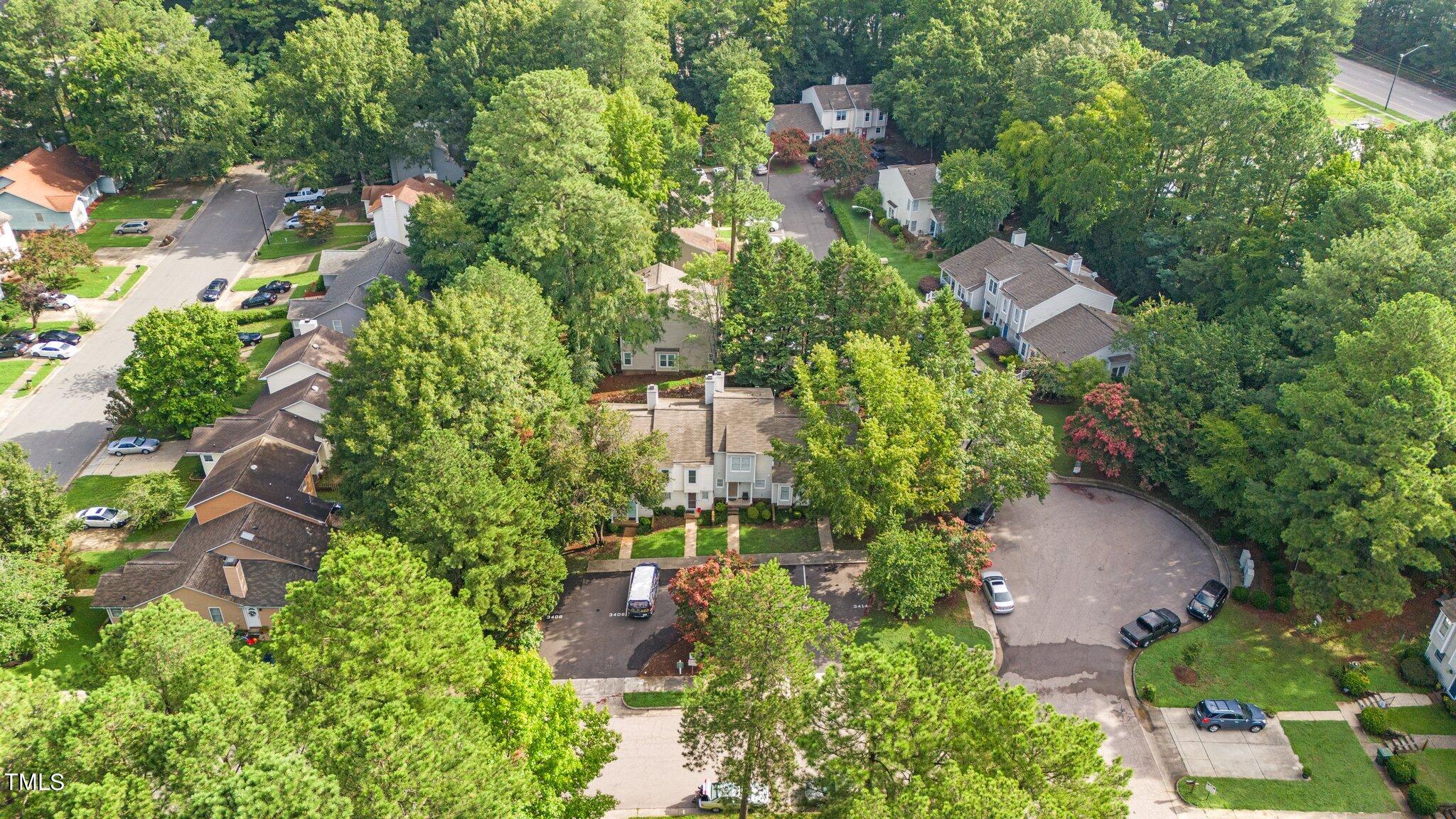 3408 Comstock Road Raleigh, NC 27604 - Photo 27 of 33 an aerial view of residential house with outdoor space and trees all around