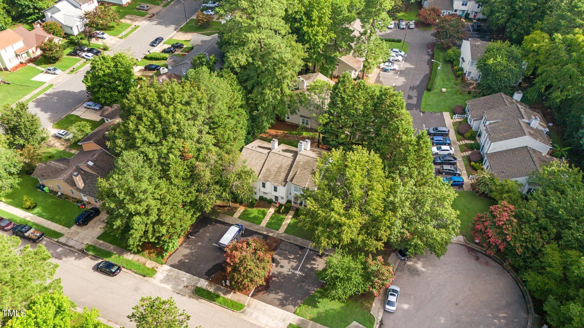 3408 Comstock Road Raleigh, NC 27604 - Photo 29 of 33 an aerial view of a house with a yard and large trees