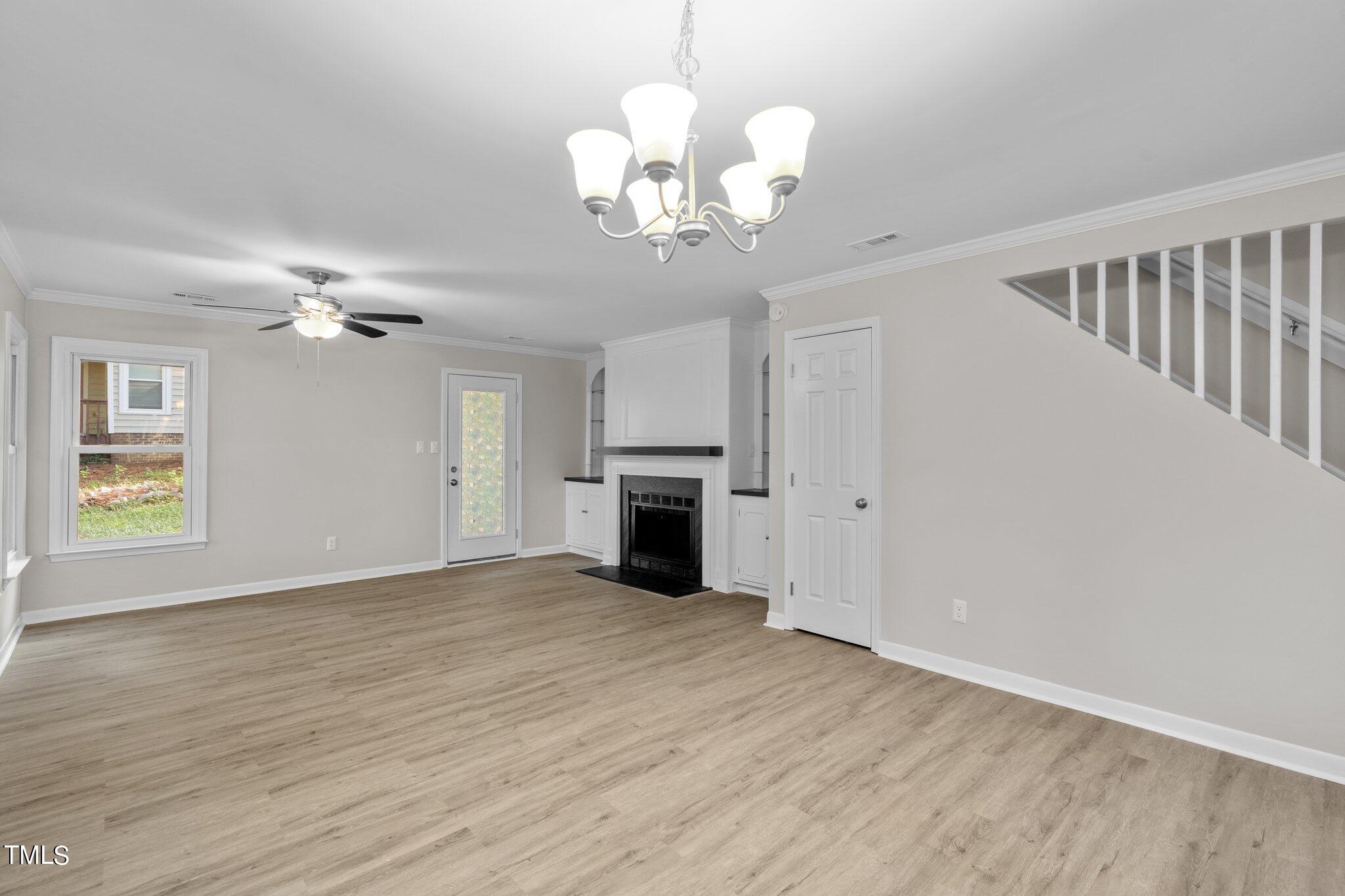 3408 Comstock Road Raleigh, NC 27604 - Photo 9 of 33 wooden floor in an empty room with a window