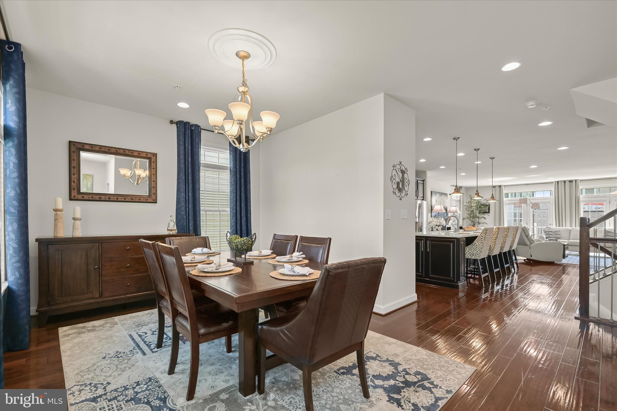 11285 Terrace Lane Fulton, MD 20759 - Photo 27 of 52 a dining room with wooden floor a chandelier a wooden table and chairs