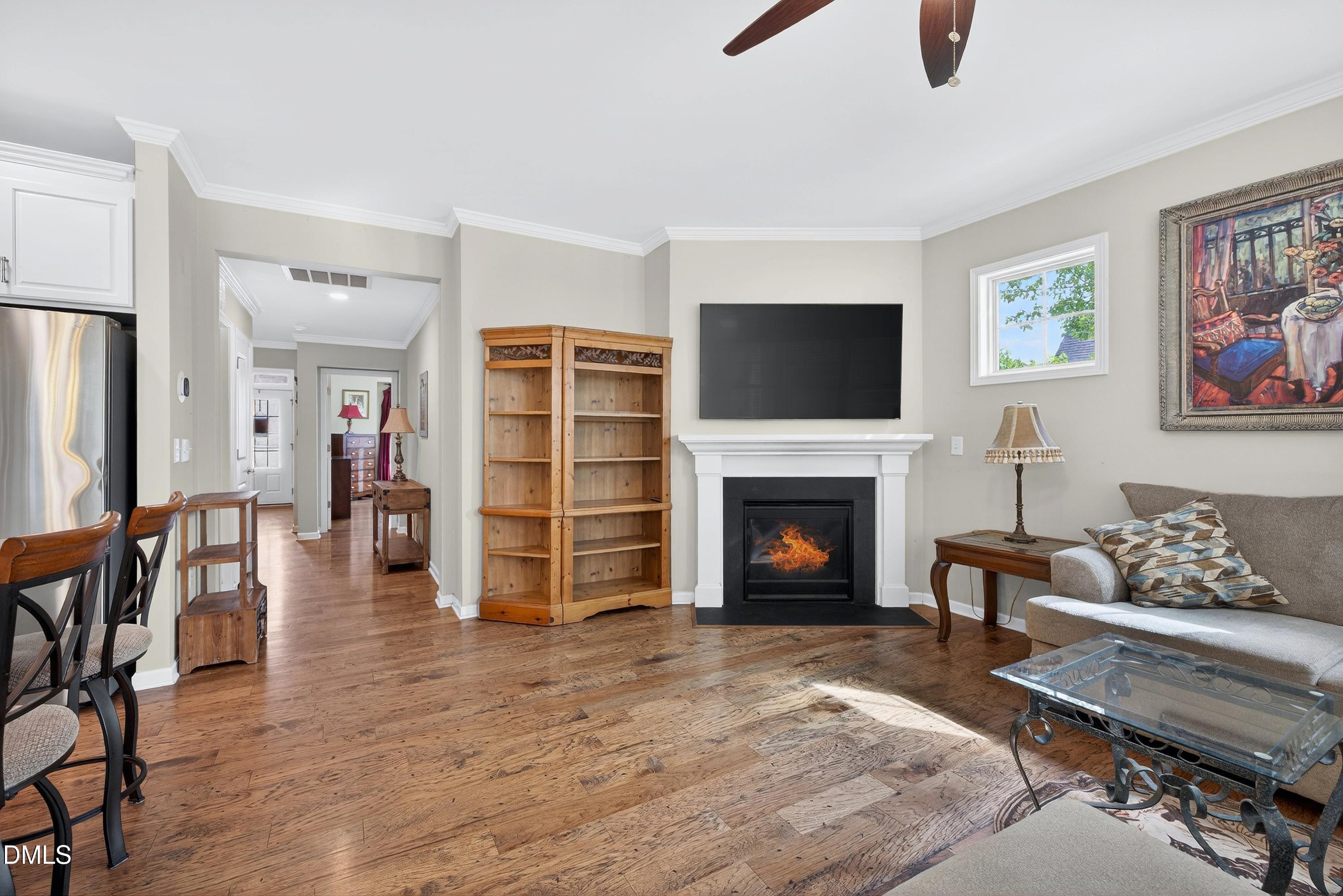 2025 Great Ridge Parkway Chapel Hill, NC 27516 - Photo 18 of 61 a living room with furniture a flat screen tv and a fireplace
