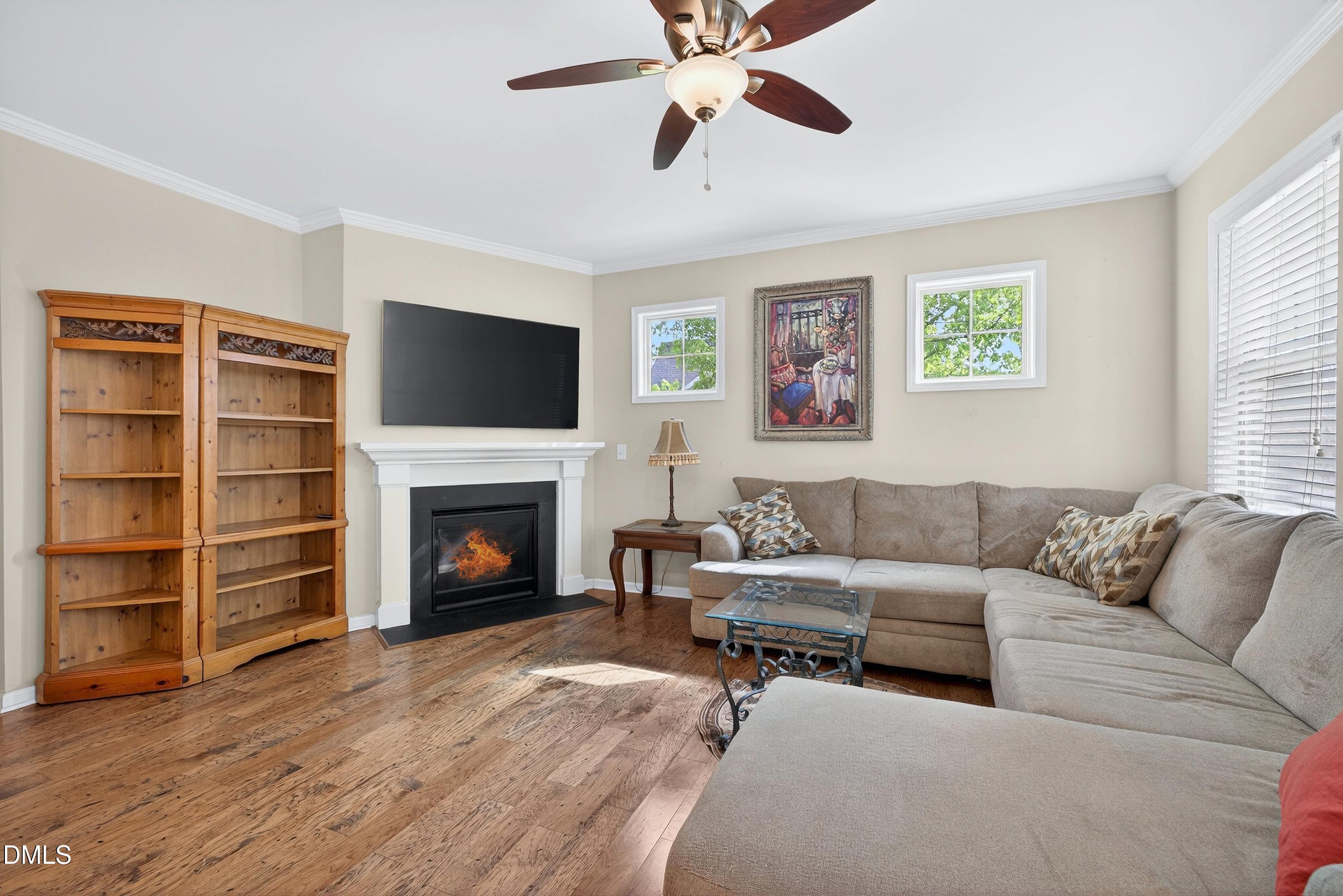 2025 Great Ridge Parkway Chapel Hill, NC 27516 - Photo 19 of 61 a living room with furniture a fireplace and a flat screen tv