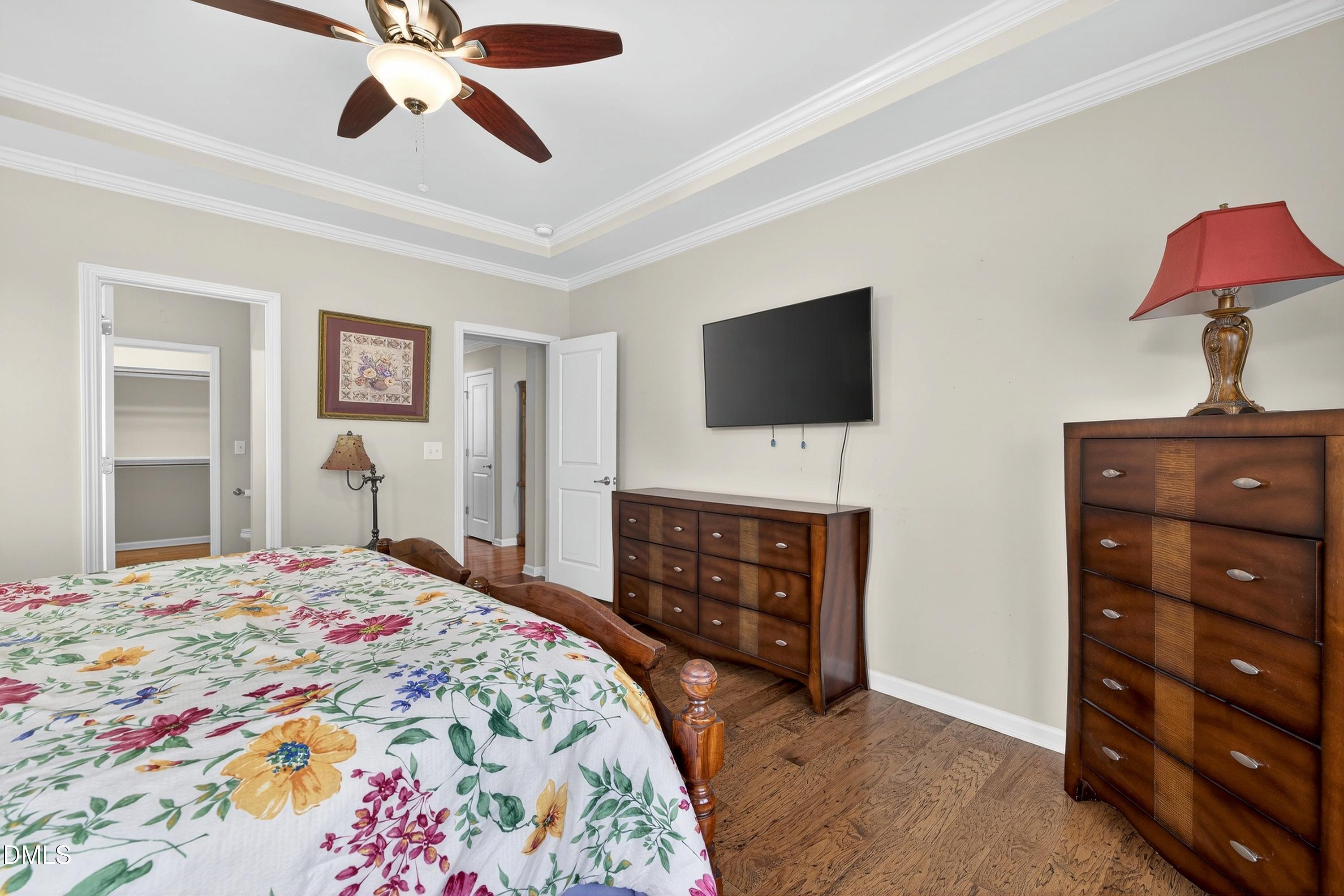 2025 Great Ridge Parkway Chapel Hill, NC 27516 - Photo 23 of 61 a bedroom with a bed and a flat screen tv