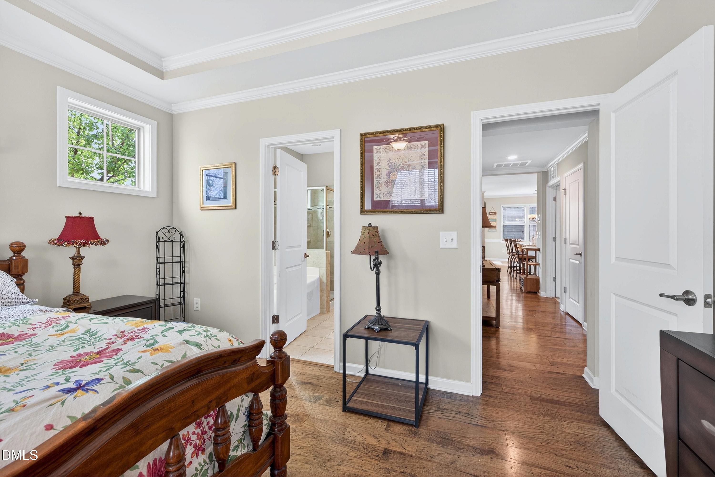 2025 Great Ridge Parkway Chapel Hill, NC 27516 - Photo 24 of 61 a bedroom with a bed and a table in it