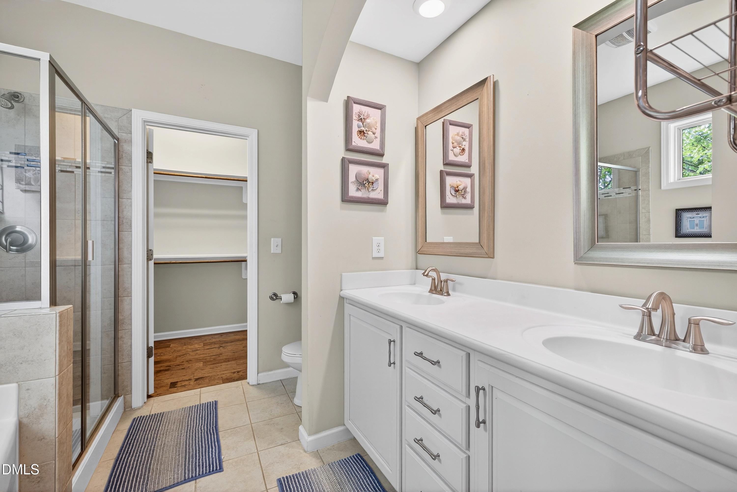 2025 Great Ridge Parkway Chapel Hill, NC 27516 - Photo 25 of 61 a bathroom with a sink double vanity and a shower