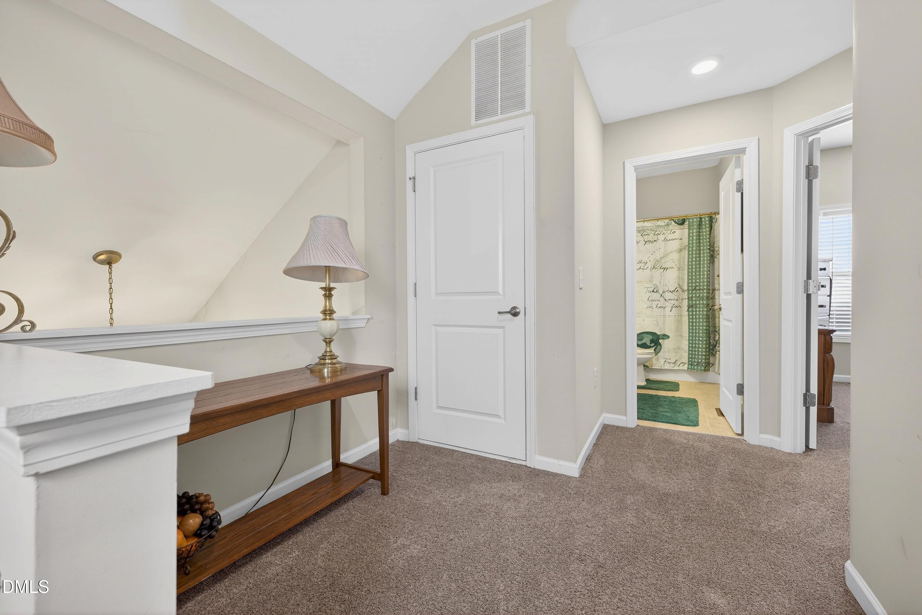 2025 Great Ridge Parkway Chapel Hill, NC 27516 - Photo 29 of 61 a view of hallway with livingroom and a couch