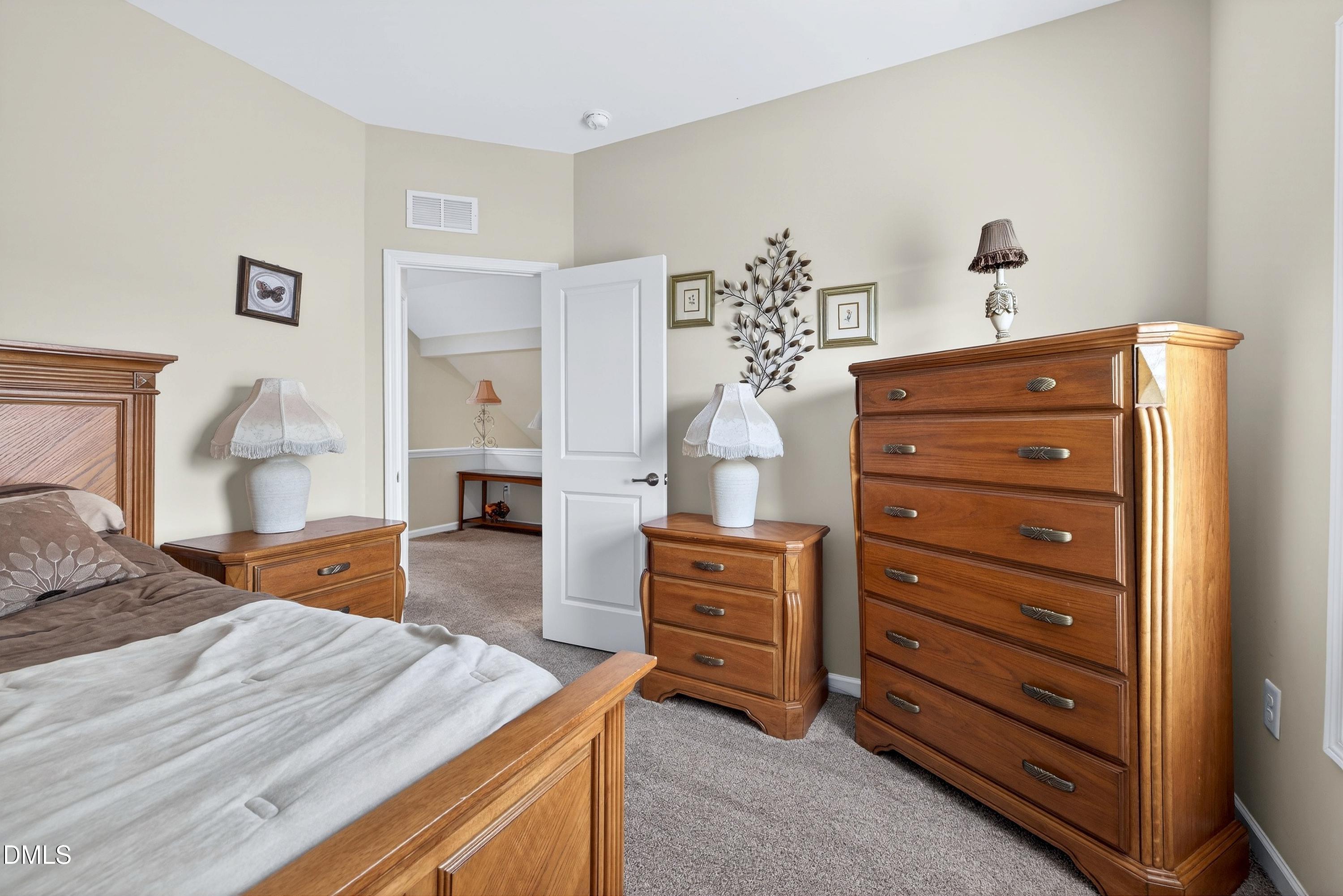 2025 Great Ridge Parkway Chapel Hill, NC 27516 - Photo 35 of 61 a bedroom with a bed and furniture