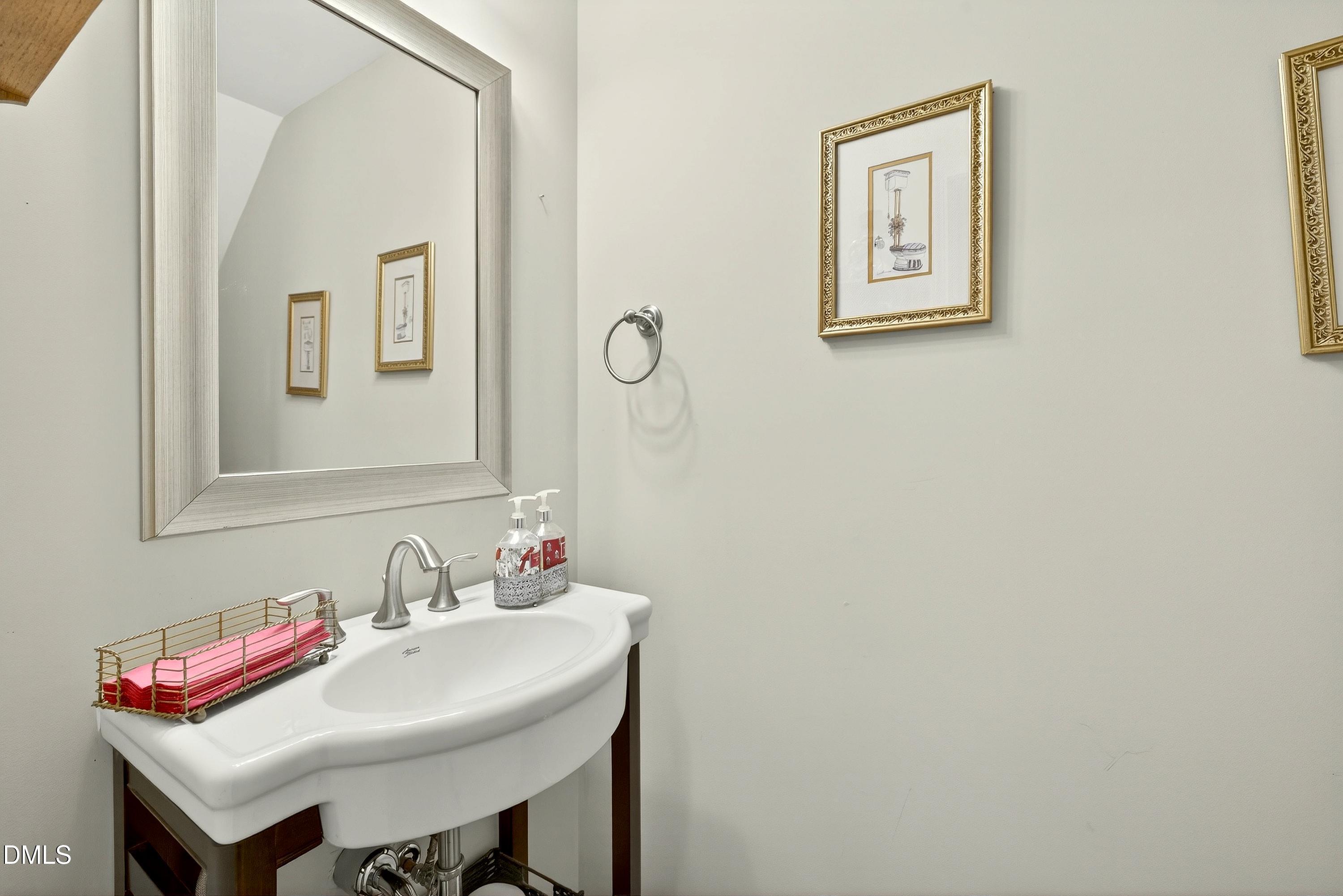 2025 Great Ridge Parkway Chapel Hill, NC 27516 - Photo 36 of 61 a bathroom with a sink and a mirror