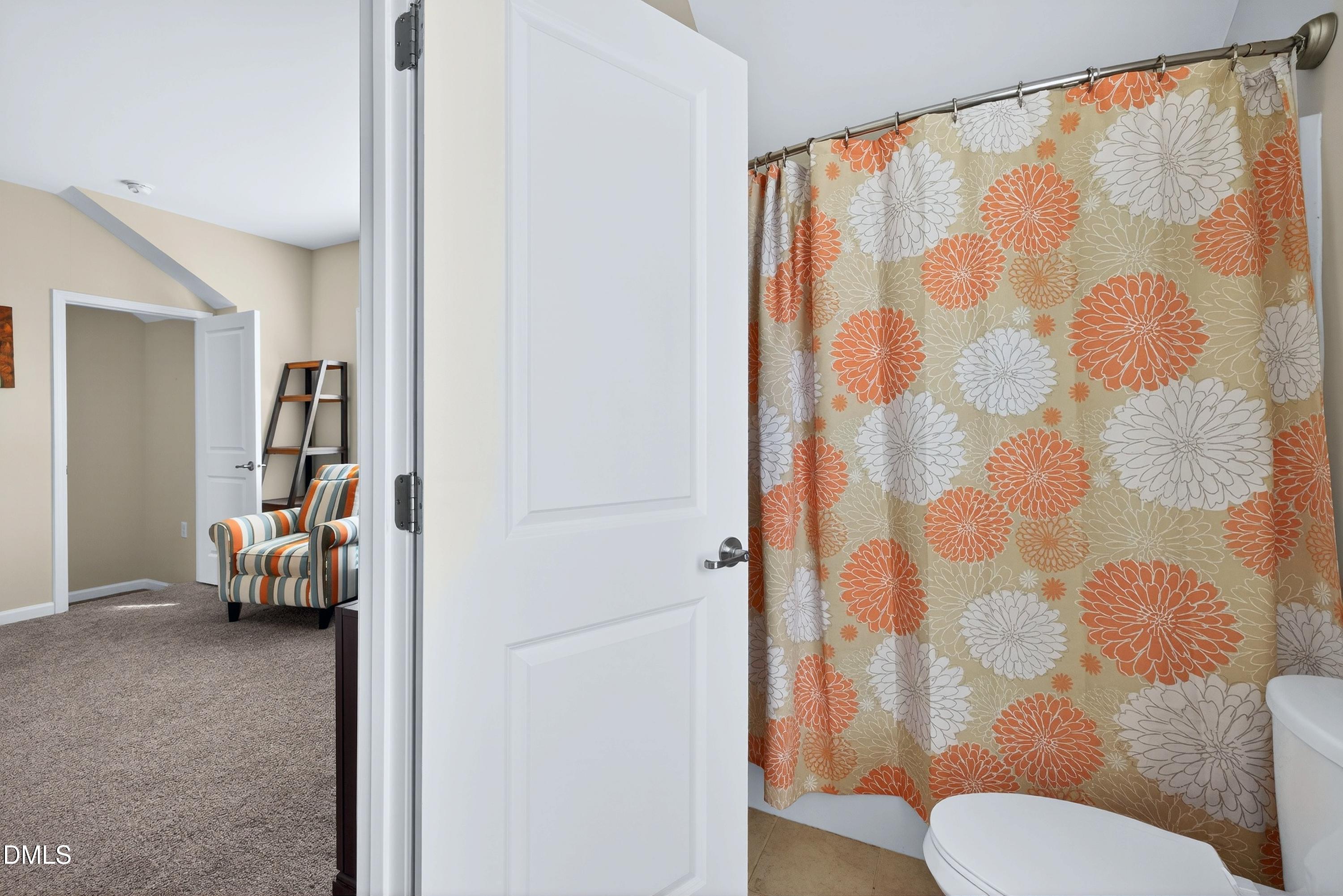 2025 Great Ridge Parkway Chapel Hill, NC 27516 - Photo 46 of 61 a bathroom with a toilet and a shower curtain