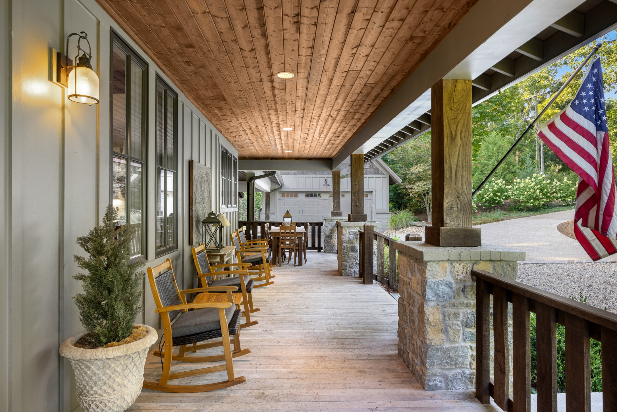 919 High Point Ridge Road Franklin, TN 37069 - Photo 12 of 53 a view of a patio with table and chairs potted plants with floor to ceiling window and potted plants
