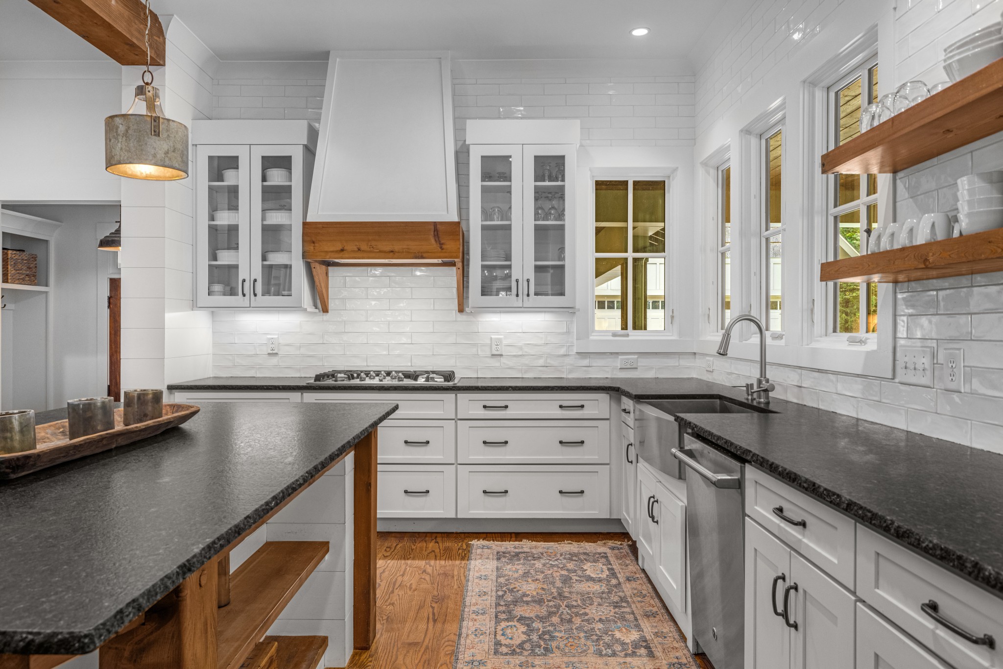 919 High Point Ridge Road Franklin, TN 37069 - Photo 19 of 53 a kitchen with granite countertop a sink stove and cabinets