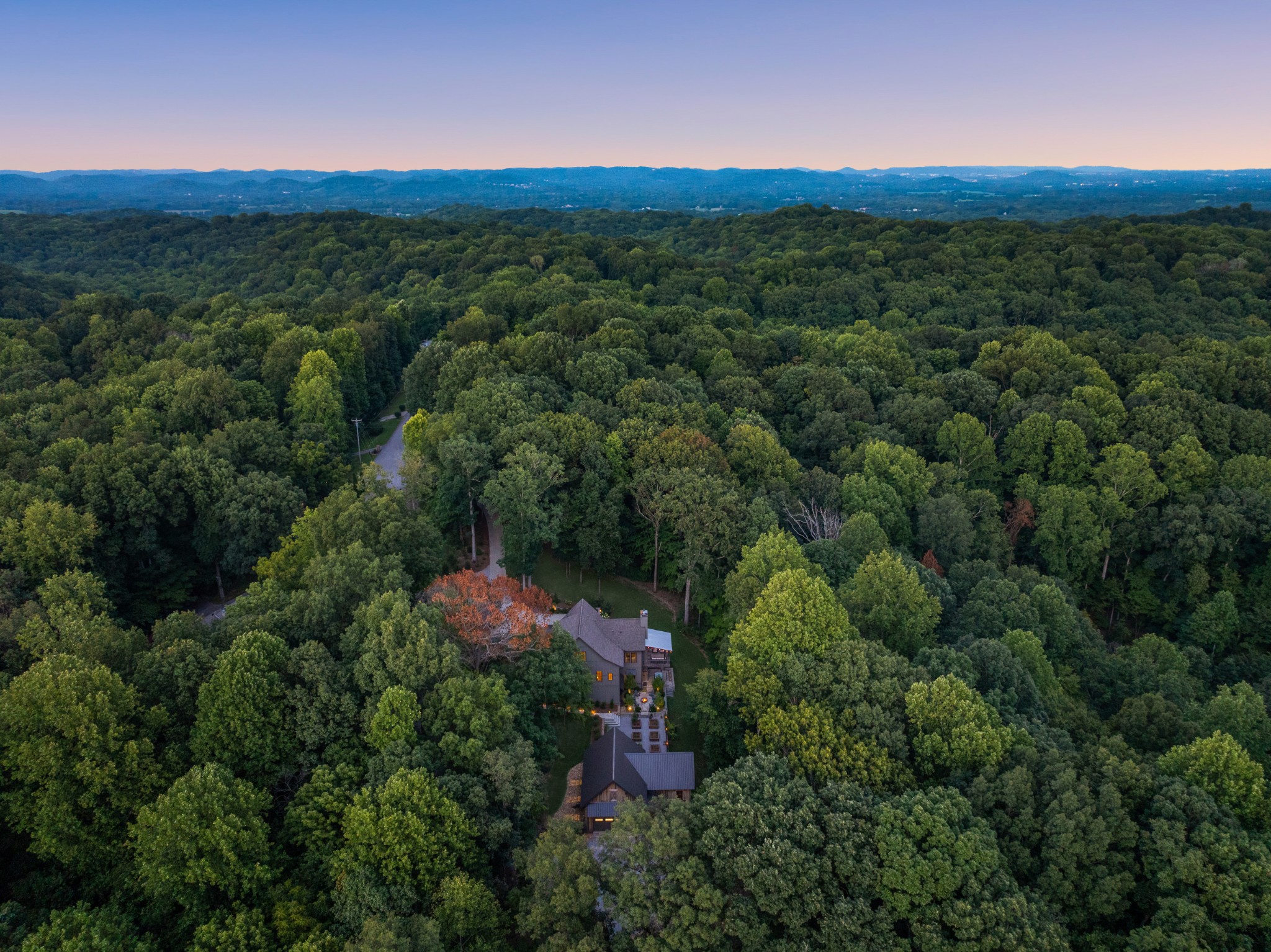 919 High Point Ridge Road Franklin, TN 37069 - Photo 53 of 53 an aerial view of green landscape with trees houses and mountain view