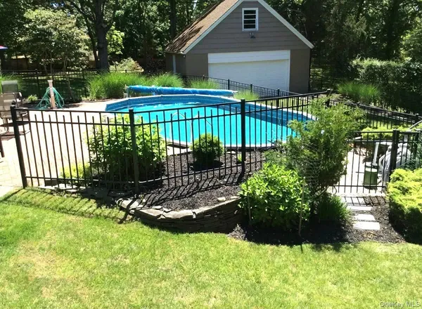 a view of a house with a yard and plants