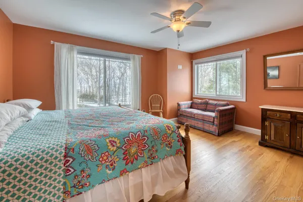 a bedroom with 2 bed and a chandelier