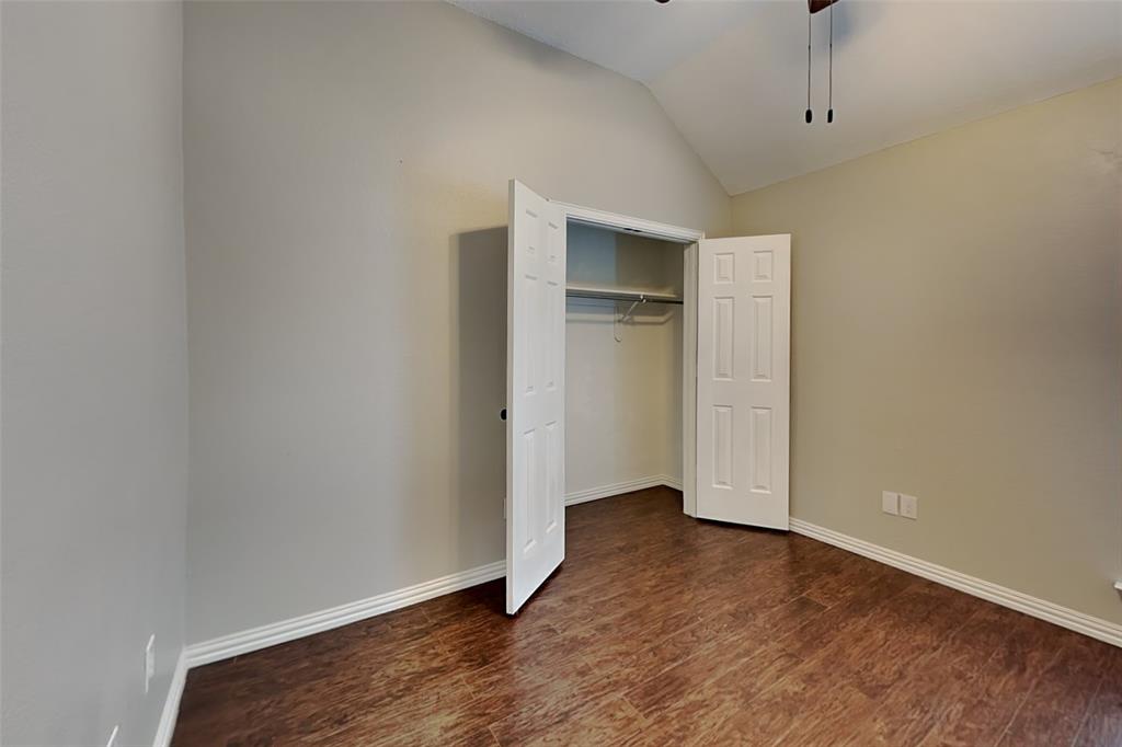 7641 Lancelot Road Frisco, TX 75035 - Photo 17 of 21 a view of an empty room with closet and wooden floor