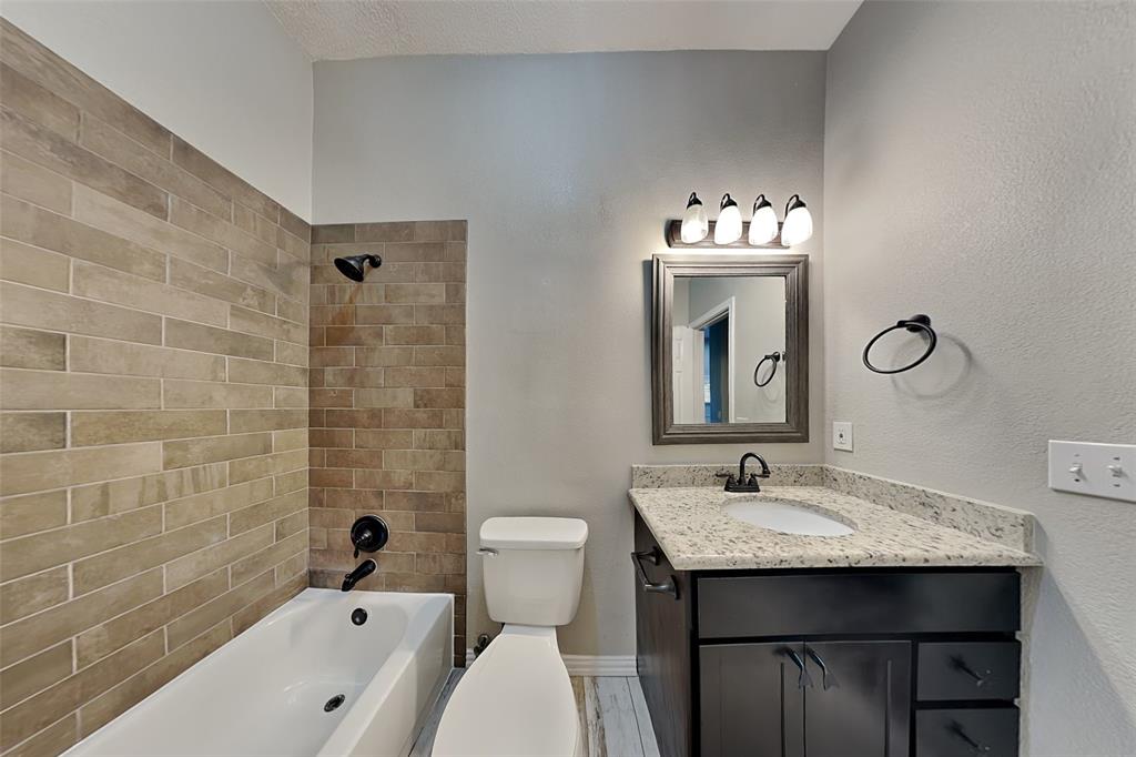 7641 Lancelot Road Frisco, TX 75035 - Photo 18 of 21 a bathroom with a sink and a mirror