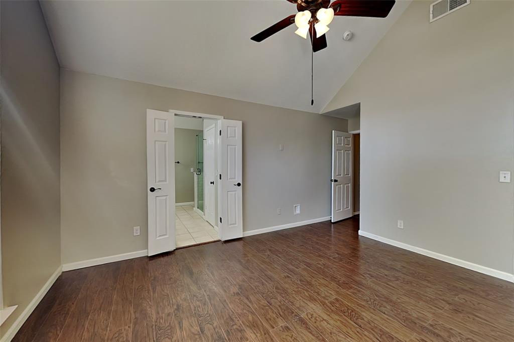 7641 Lancelot Road Frisco, TX 75035 - Photo 9 of 21 a view of an empty room with a chandelier fan