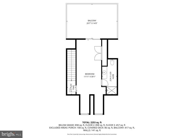 a picture of a bench in front of a wall