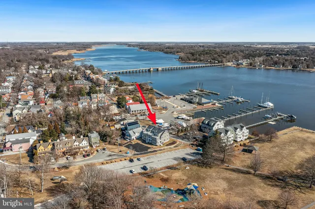 an aerial view of a houses with a yard