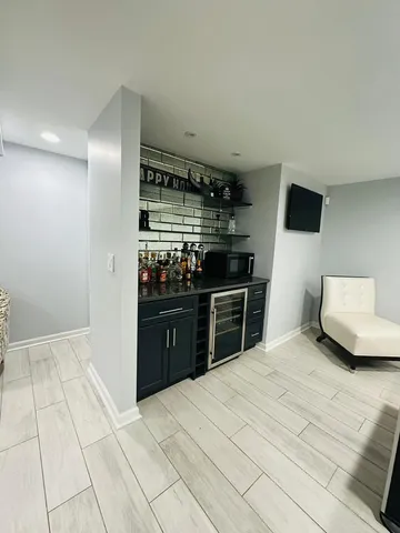 a room with a bed and a television