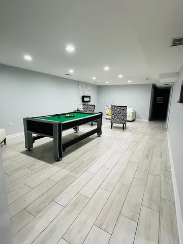 a lobby with furniture and a potted plant