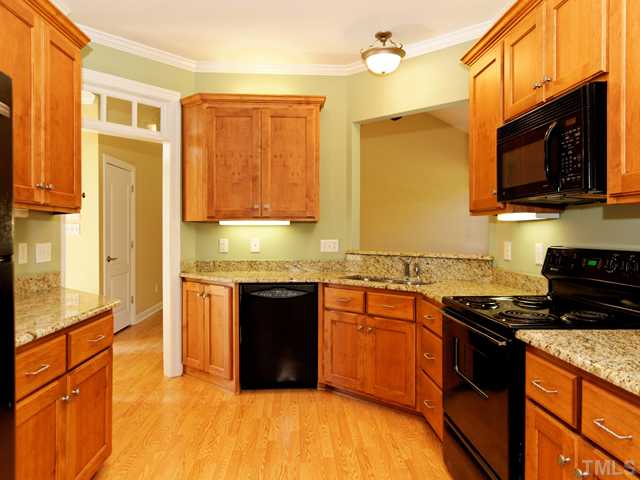 205 Spring Park Road Wake Forest, NC 27587 - Photo 3 of 25 Custom kitchen with granite counter tops!