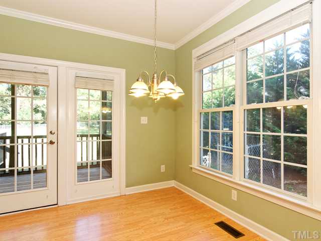 205 Spring Park Road Wake Forest, NC 27587 - Photo 5 of 25 Light and bright dining area with direct access to the screened porch!