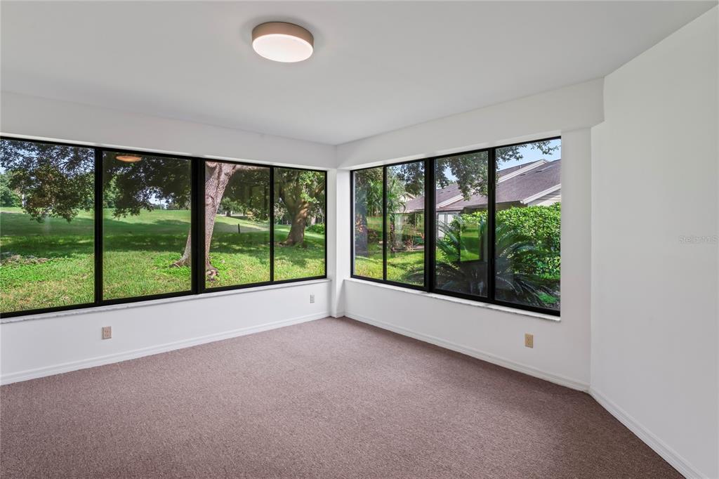 9108 Bassett Lane, Unit B New Port Richey, FL 34655 - Photo 20 of 66 a view of a room with a large window